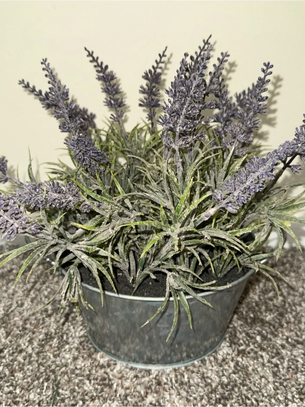Artificial lavender plant in silver bucket